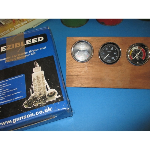 75 - A parcel of vintage motoring related items, to include oil cans and test equipment, all in used cond... 