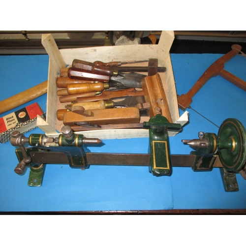 76 - A parcel of vintage tools, to include a bench top lathe and chisels and a good axe, all in used cond... 