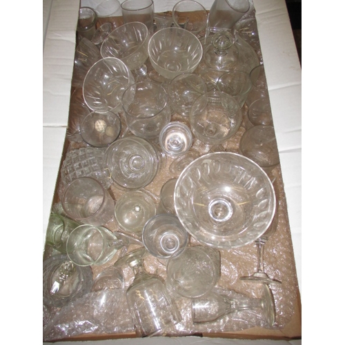 82 - A large quantity of antique and later glasswares, to include decanters and hand-blown drinking glass... 