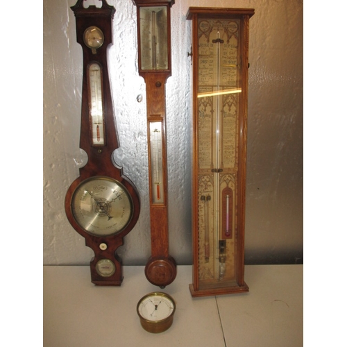 170 - 3 antique wood cased wall barometers and one later brass cased example. Non tested as to functioning... 