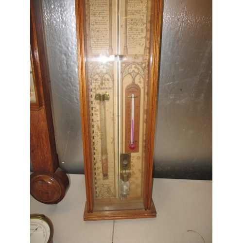 170 - 3 antique wood cased wall barometers and one later brass cased example. Non tested as to functioning... 