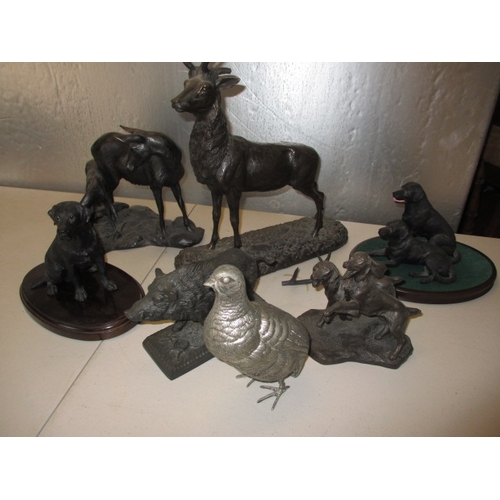 171 - A quantity of animal sculptures to include dogs and hogs. In pre-owned condition, the stag with one ... 