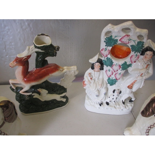 175 - 2 vintage Staffordshire flatbacks and a pair of mantle dogs. In good pre-owned condition