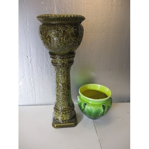 184 - A jardinière on stand and an art nouveau jardiniere. Both bowls having repairs