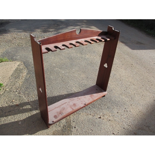 189 - A vintage mahogany 10 place gun rack. Age related marks and wear. Approximate width 97cm, height 100... 