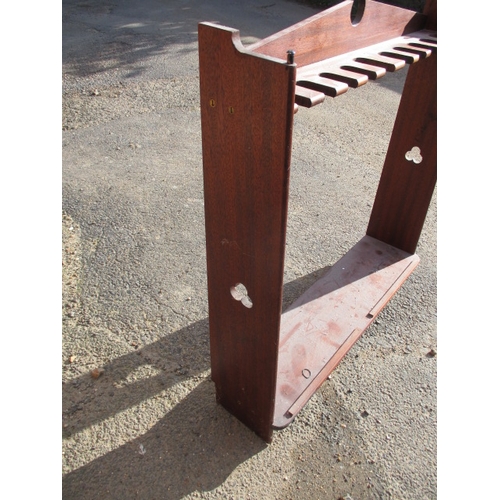 189 - A vintage mahogany 10 place gun rack. Age related marks and wear. Approximate width 97cm, height 100... 