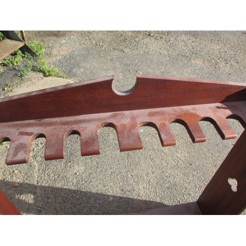 189 - A vintage mahogany 10 place gun rack. Age related marks and wear. Approximate width 97cm, height 100... 