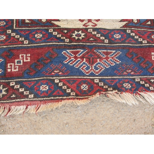 193 - A vintage Persian hand knotted wool rug. Approximate size 190cm x 130cm, in used condition with mino... 