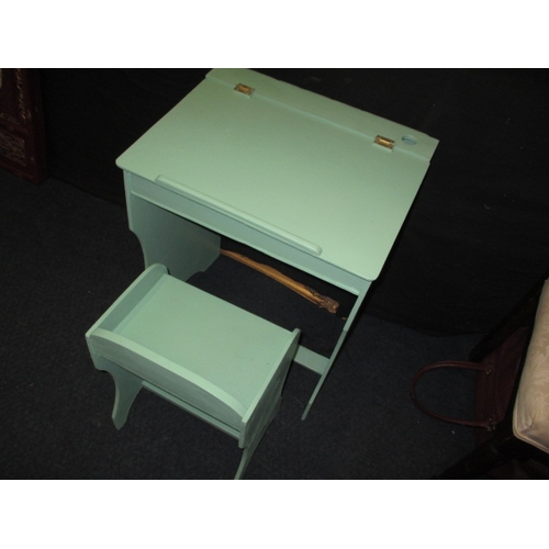 198 - A vintage child’s desk and stool, painted pale green and in useable pre-owned condition