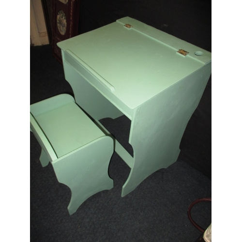 198 - A vintage child’s desk and stool, painted pale green and in useable pre-owned condition