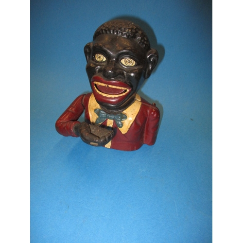 199 - A vintage cast iron mechanical money box, in good useable pre-owned condition, approx. height 16cm