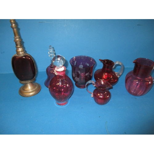 204 - A parcel of vintage cranberry glass items, all in pre-owned condition, one with crack to neck all ot... 