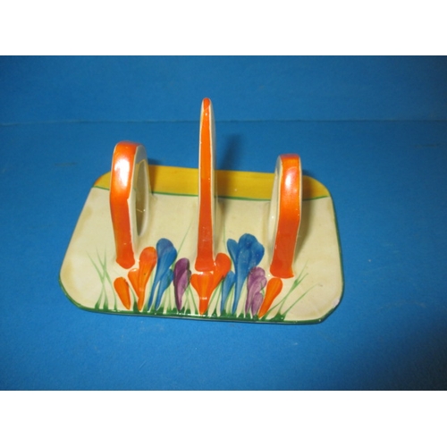 189 - A Clarice Cliff autumn crocus design conical toast rack, fully marked to base, in good used conditio... 