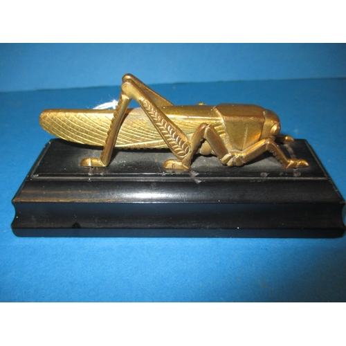 A 1963 Martins Bank bronze grasshopper paperweight, issued for their 400th anniversary, in good used condition, approx. length 13cm