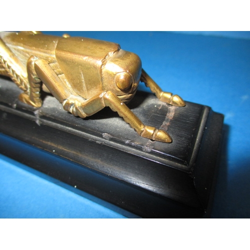 140 - A 1963 Martins Bank bronze grasshopper paperweight, issued for their 400th anniversary, in good used... 