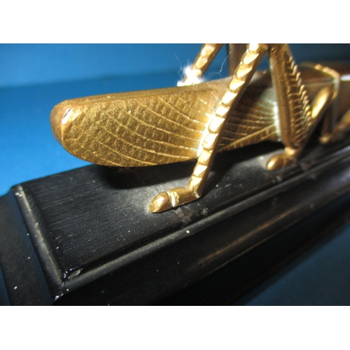 140 - A 1963 Martins Bank bronze grasshopper paperweight, issued for their 400th anniversary, in good used... 