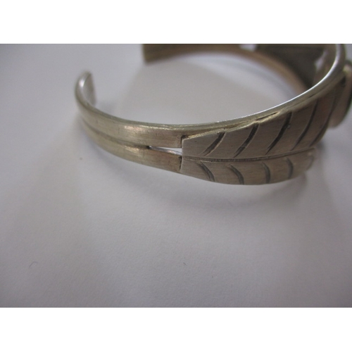 141 - A near antique American Navajo tribe coin silver wrist cuff with central hard stone, being hand made... 