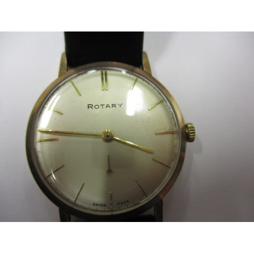 72 - A vintage Rotary wrist watch, runs when wound, believed to be a gold body, having replacement strap ... 