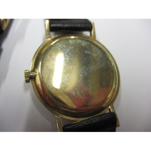 72 - A vintage Rotary wrist watch, runs when wound, believed to be a gold body, having replacement strap ... 