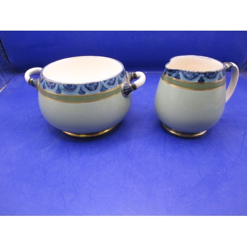 187 - A Macintyre cream jug and sugar bowl both with Burslem back stamps’, both with no observed damage or... 