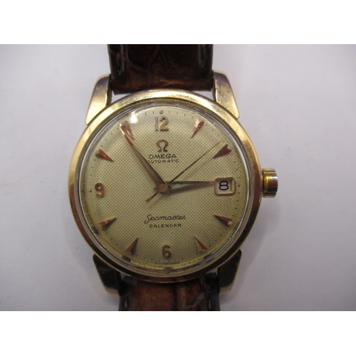 73 - An early 1960s Omega Seamaster automatic date watch, the dial measuring approx. 30mm, one owner from... 