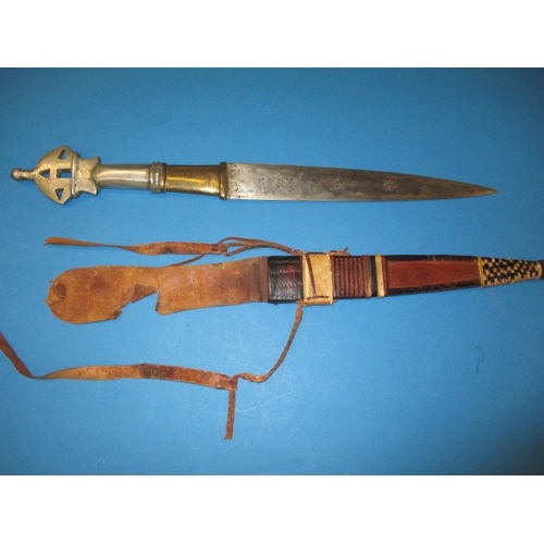A WWII era West African dagger, gifted to vendors father by locals in c1945, with sheath, in good pre-owned condition, approx. length 52cm