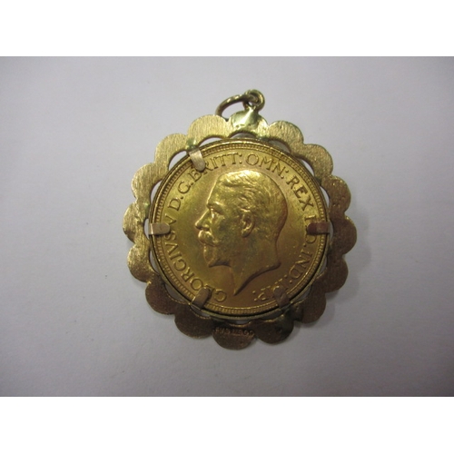 90 - A George V full gold sovereign dated 1930, in 9ct gold pendant mount, a circulated coin with good de... 