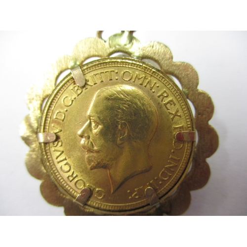 90 - A George V full gold sovereign dated 1930, in 9ct gold pendant mount, a circulated coin with good de... 