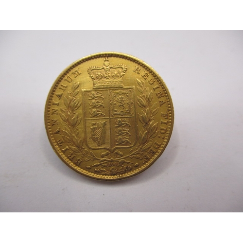 93 - A Victorian full gold sovereign dated 1872, having shield back, die number 100, a circulated coin wi... 