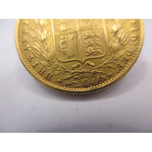 93 - A Victorian full gold sovereign dated 1872, having shield back, die number 100, a circulated coin wi... 