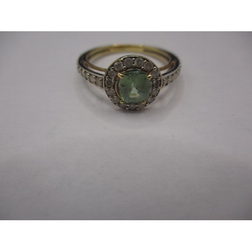 1 - A vintage 750 yellow and white gold dress ring, set with diamonds and central peridot?. Approx. ring... 