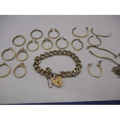 64 - A parcel of 9ct gold items, to include a good curb ling bracelet and coin mounts, damages so sold as... 