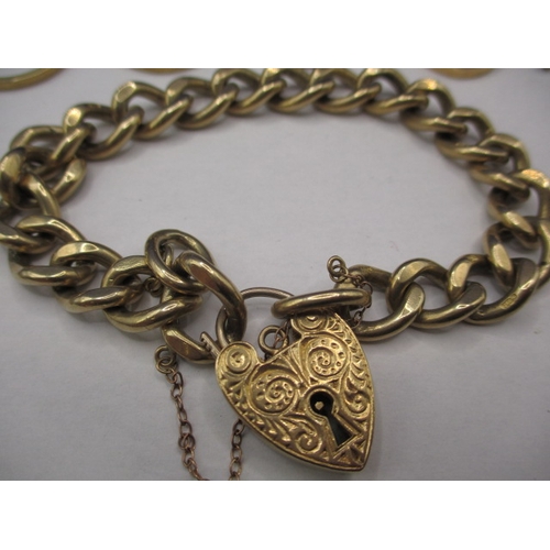 64 - A parcel of 9ct gold items, to include a good curb ling bracelet and coin mounts, damages so sold as... 