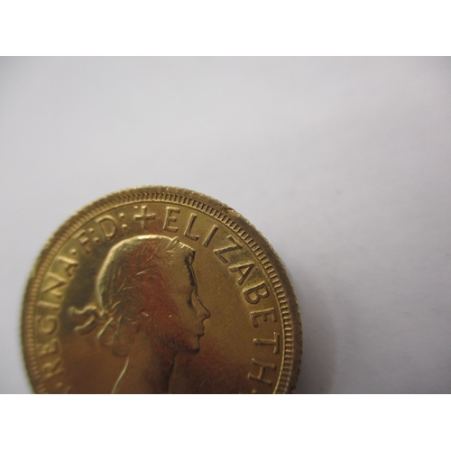 105 - A Queen Elizabeth II gold sovereign dated 1963, a good grade bullion coin with signs of being in a m... 