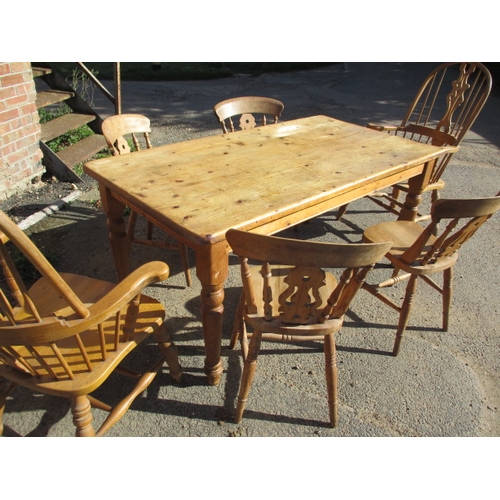 268 - A vintage country house kitchen table and chairs. 4+2 chairs, in pre-owned condition, one spindle mi... 