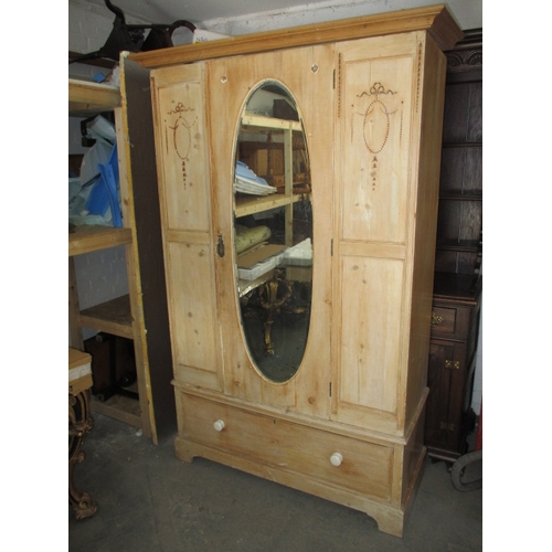 266 - A waxed natural wood wardrobe, having drawer base and mirrored door. Comes in 3 parts for ease of tr... 