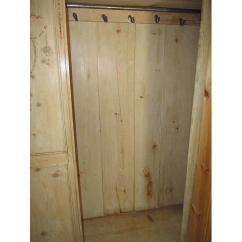 266 - A waxed natural wood wardrobe, having drawer base and mirrored door. Comes in 3 parts for ease of tr... 