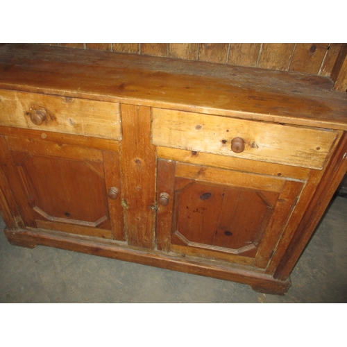 272 - An antique, farmhouse natural pine dresser of small proportions. In well used condition. Approximate... 