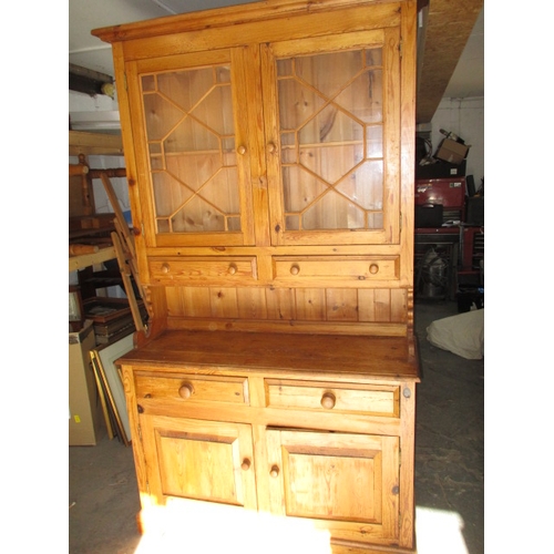 271 - A vintage stripped pine dresser, with glazed 2 door top and 4 drawers over 2 cupboards. Removable to... 