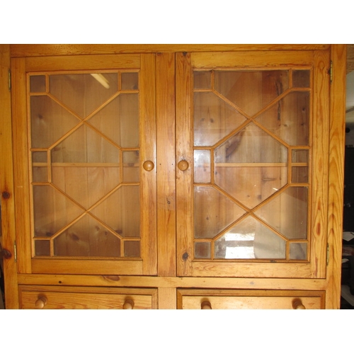 271 - A vintage stripped pine dresser, with glazed 2 door top and 4 drawers over 2 cupboards. Removable to... 