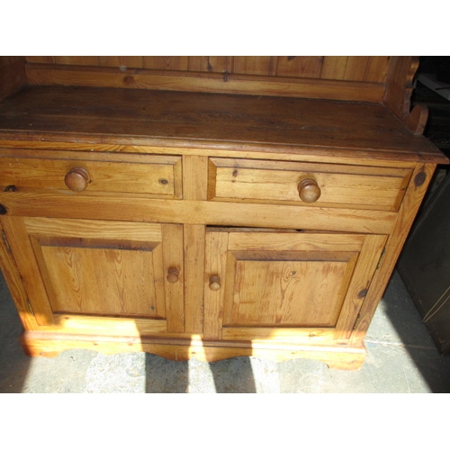 271 - A vintage stripped pine dresser, with glazed 2 door top and 4 drawers over 2 cupboards. Removable to... 