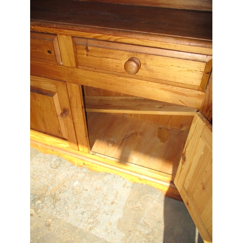 271 - A vintage stripped pine dresser, with glazed 2 door top and 4 drawers over 2 cupboards. Removable to... 