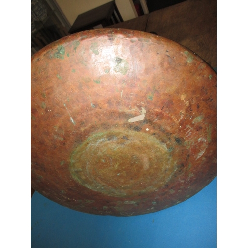 248 - A large antique copper water carrier, approx. height 50cm, in pre-owned condition with general age-r... 