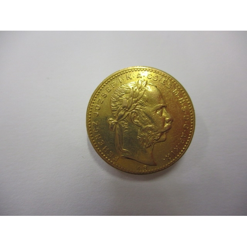 117 - An 1881 Hungarian 20 franc gold coin, approx. weight 6.4g in good circulated condition with fine def... 