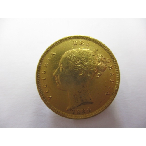 121 - A Victorian gold half sovereign dated 1884, with shield back, a well circulated coin with fine defin... 