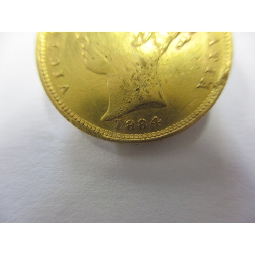 121 - A Victorian gold half sovereign dated 1884, with shield back, a well circulated coin with fine defin... 