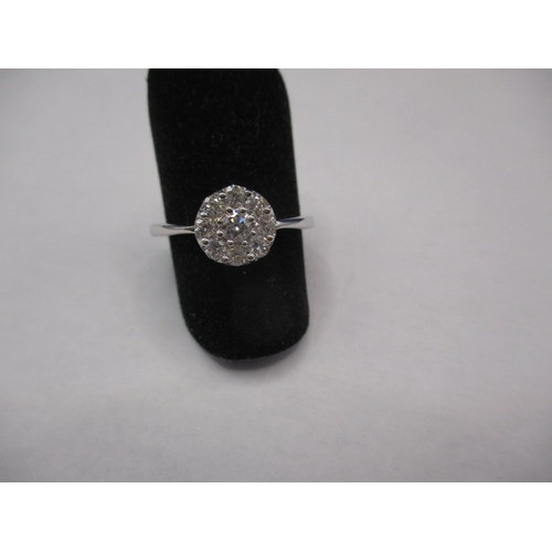 13 - An 18ct white gold diamond cluster ring, approx. ring size ‘M+’, approx. weight 2.55g, in good pre-o... 