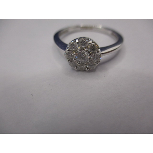 13 - An 18ct white gold diamond cluster ring, approx. ring size ‘M+’, approx. weight 2.55g, in good pre-o... 