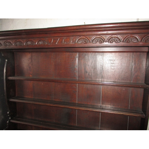 273 - An antique oak kitchen dresser, with removable top rack 3 frieze drawers, central dummy drawers and ... 