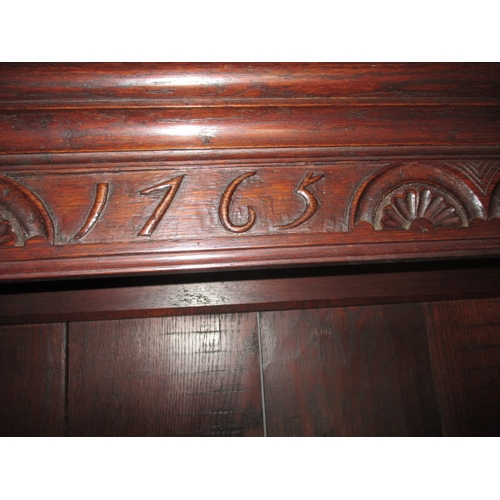 273 - An antique oak kitchen dresser, with removable top rack 3 frieze drawers, central dummy drawers and ... 